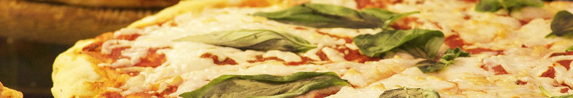 Eating Pizza at Aegean Pizza restaurant in Hyannis, MA.